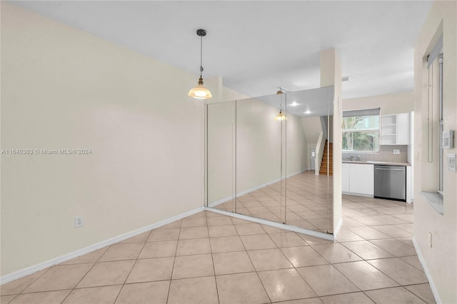 interior space with sink and light tile patterned floors