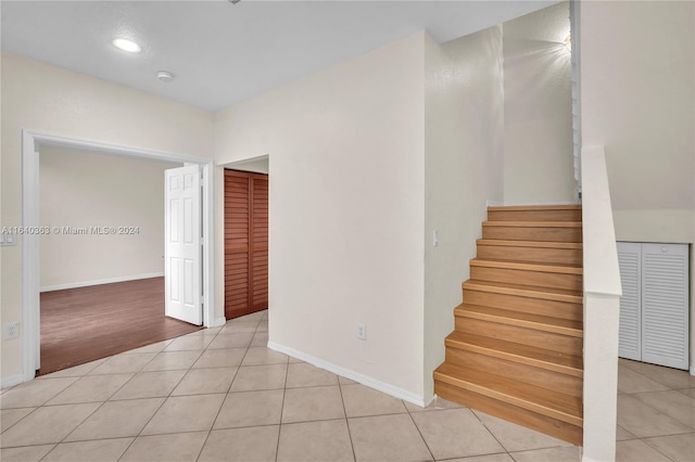 staircase with tile patterned floors