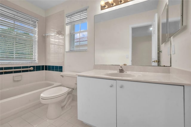 bathroom with tile patterned flooring, toilet, a bathtub, and vanity