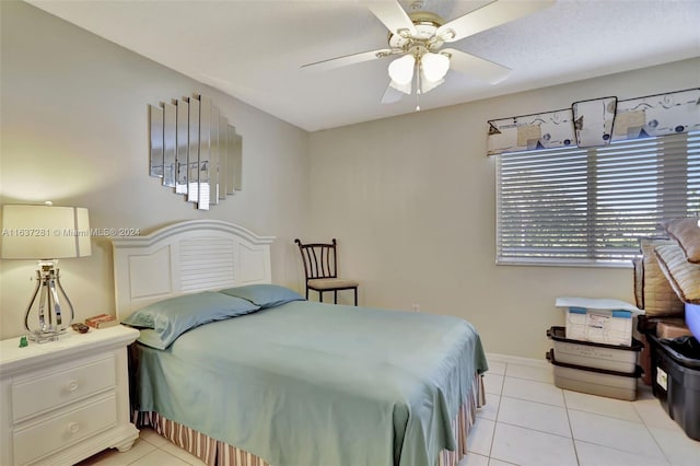 bedroom featuring light tile patterned floors and ceiling fan