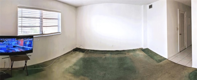 unfurnished room with carpet floors