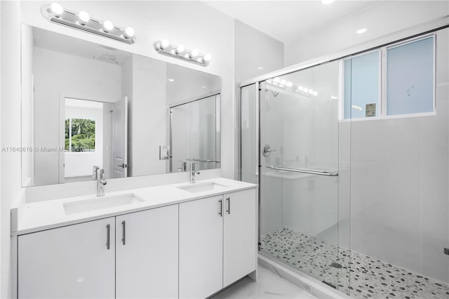 bathroom featuring dual vanity, tile patterned floors, and walk in shower