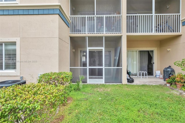 exterior space with a lawn and a patio