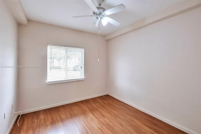 spare room featuring ceiling fan and light hardwood / wood-style floors