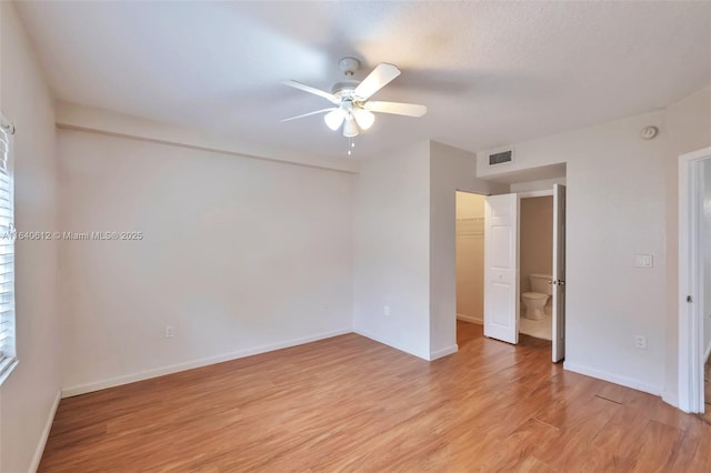 unfurnished room with ceiling fan and light hardwood / wood-style floors