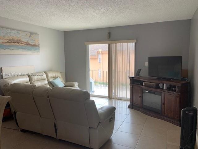 tiled living room with a textured ceiling