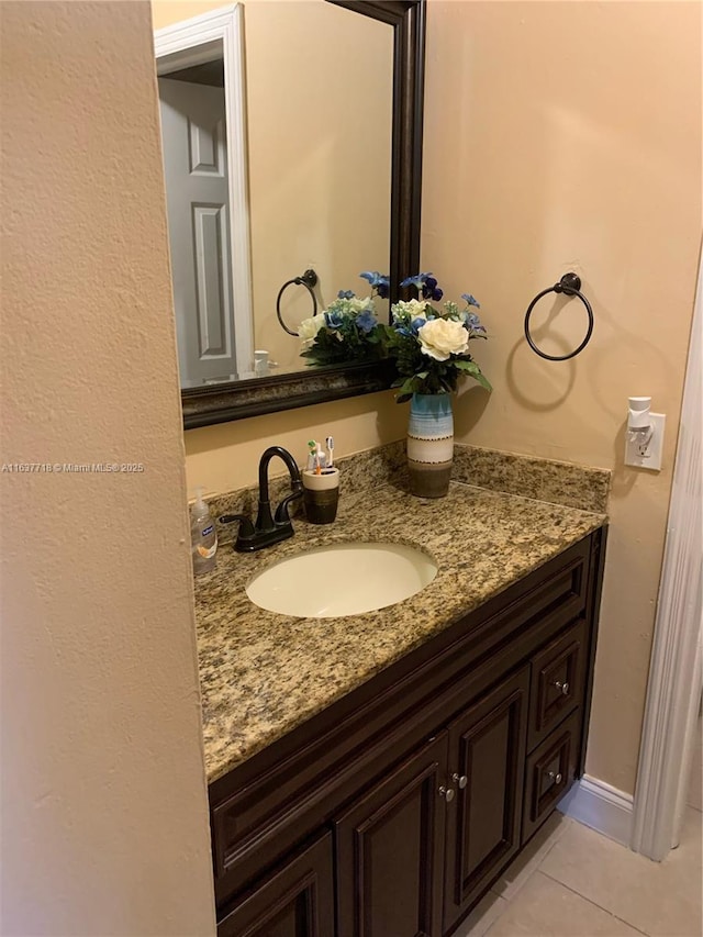 bathroom with vanity and tile patterned flooring