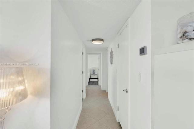 corridor with light tile patterned floors