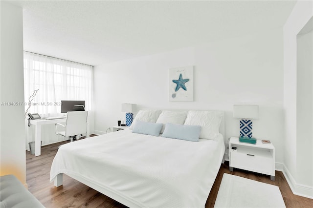 bedroom featuring wood-type flooring