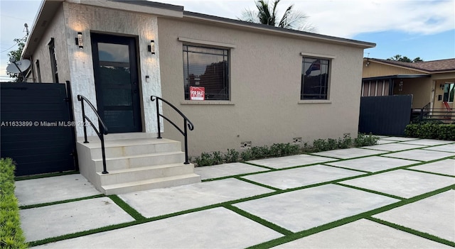 view of front of home with a patio