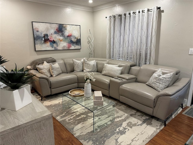 living room featuring hardwood / wood-style flooring and crown molding