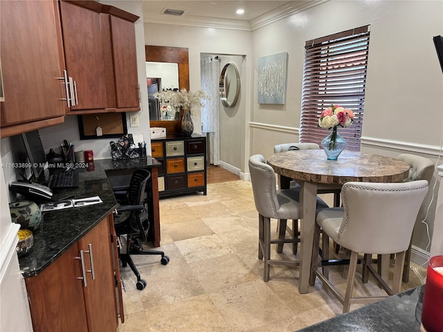 office area featuring light tile patterned floors and crown molding