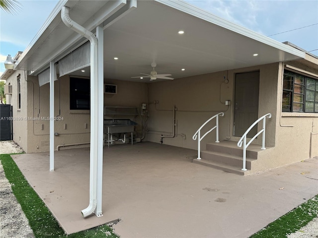 view of patio featuring ceiling fan