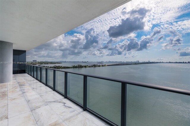 balcony featuring a water view