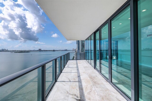 balcony featuring a water view