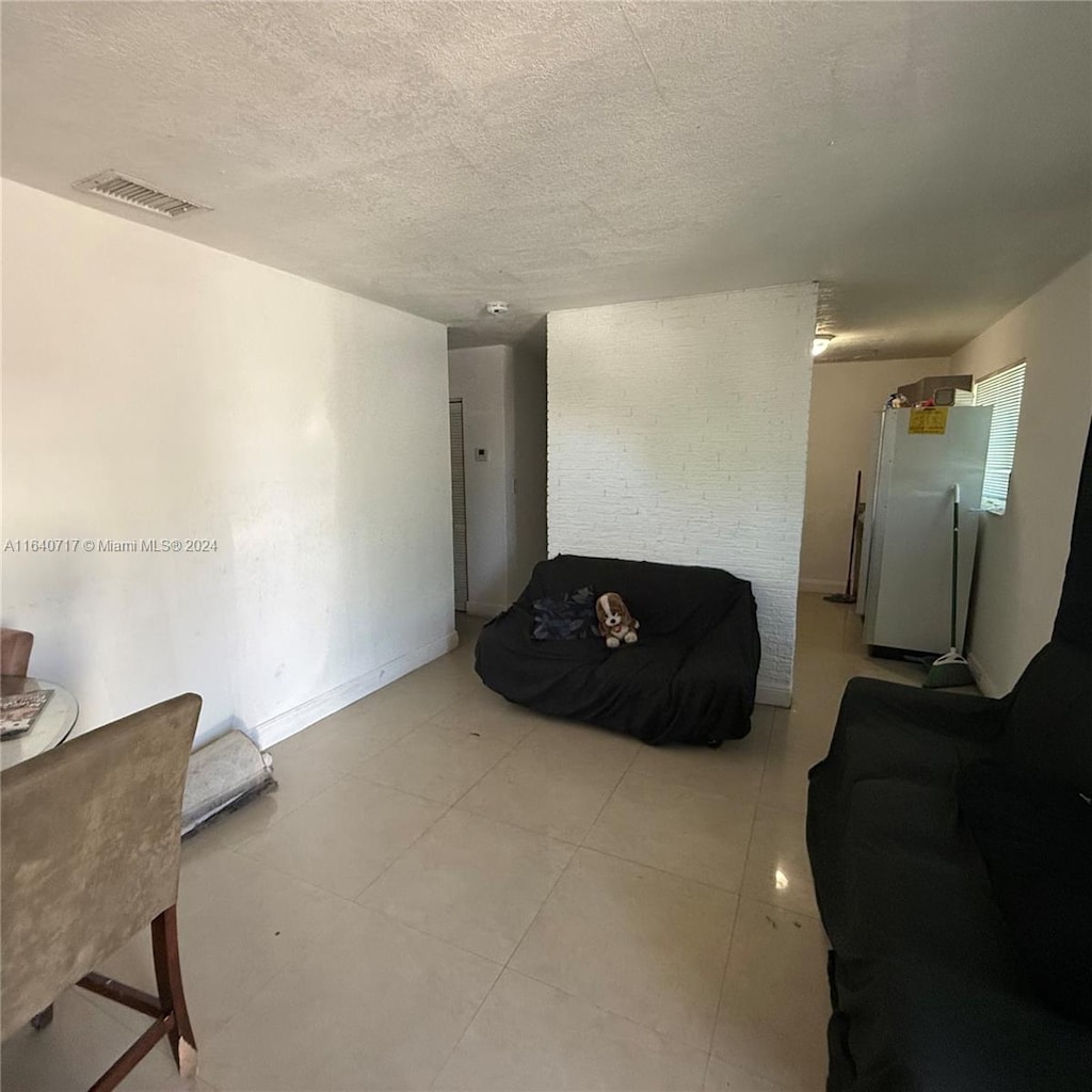 living room featuring a textured ceiling