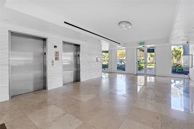 interior space featuring french doors and elevator