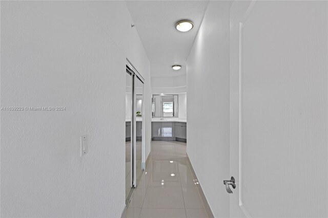 corridor featuring tile patterned flooring