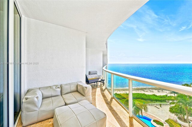 balcony with a view of the beach and a water view