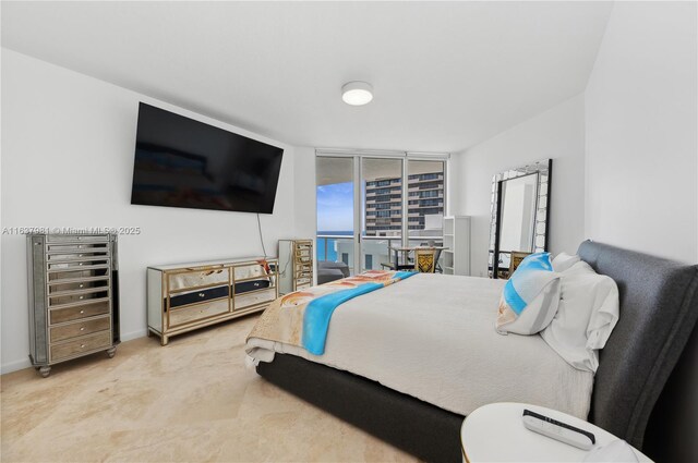 bedroom with floor to ceiling windows