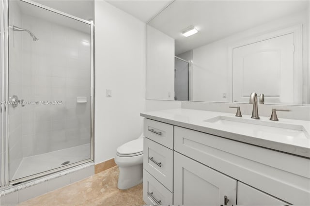 bathroom featuring walk in shower, tile patterned floors, vanity, and toilet