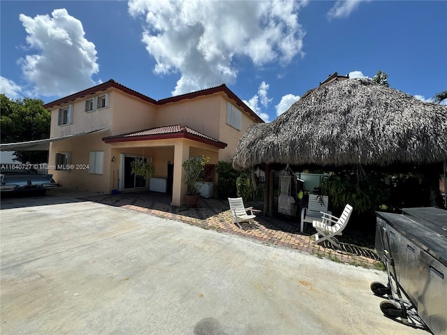 view of side of property with a patio