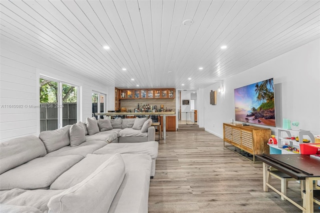 living room with light wood-type flooring and wooden ceiling