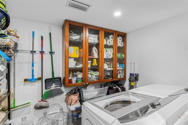 laundry area with washing machine and dryer