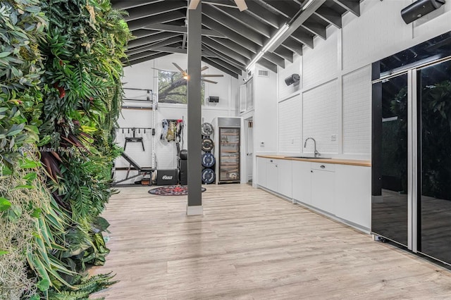 view of patio / terrace with a wooden deck and sink