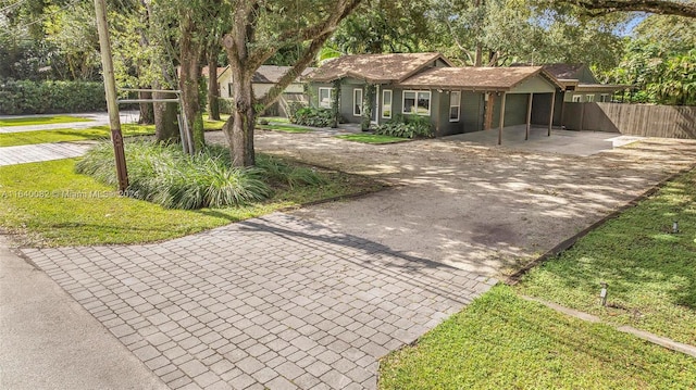 single story home featuring a front lawn