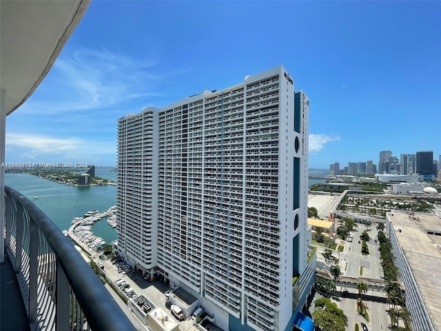 exterior space featuring a view of city and a water view