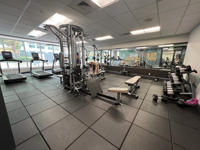 workout area featuring a drop ceiling and visible vents