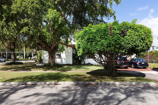 surrounding community featuring a lawn