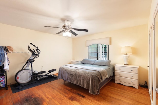 bedroom with hardwood / wood-style floors and ceiling fan