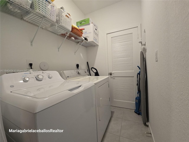 washroom featuring light tile patterned flooring and separate washer and dryer