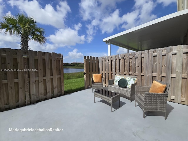 view of patio with a water view