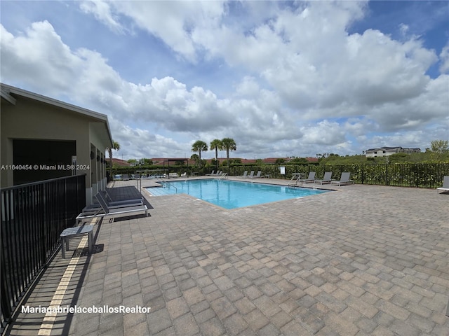 view of swimming pool featuring a patio area