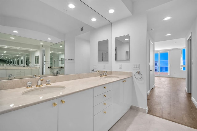 bathroom with hardwood / wood-style flooring and vanity