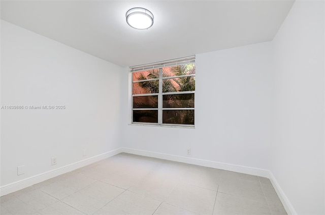 spare room with light tile patterned floors