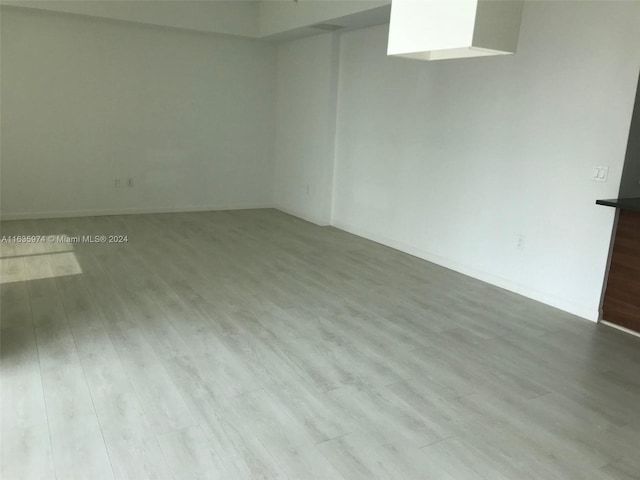 unfurnished room with light hardwood / wood-style flooring