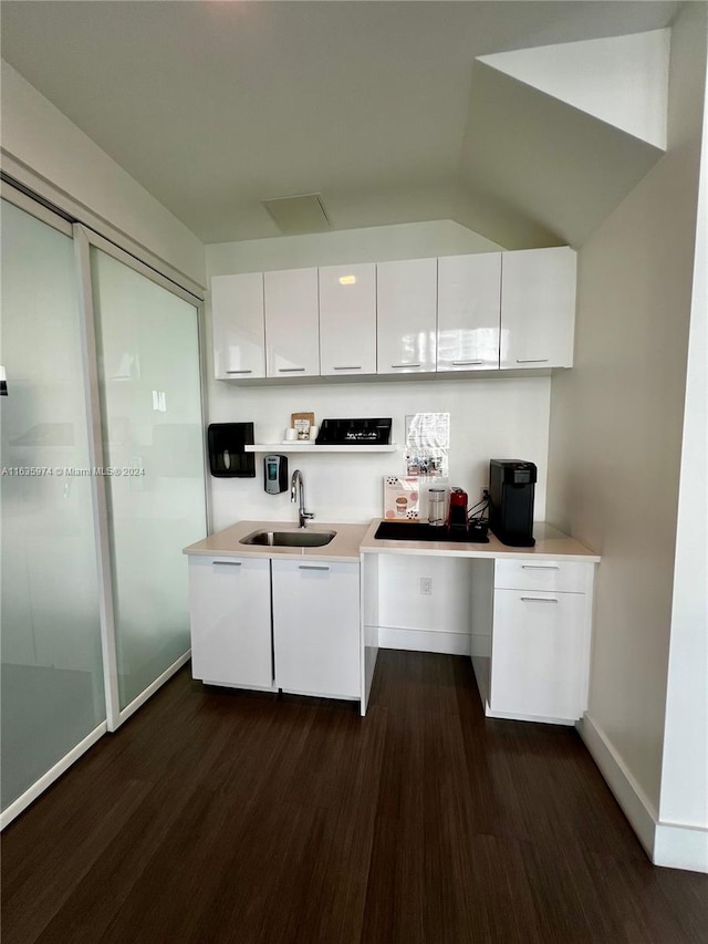 kitchen with white cabinets, sink, and dark hardwood / wood-style floors