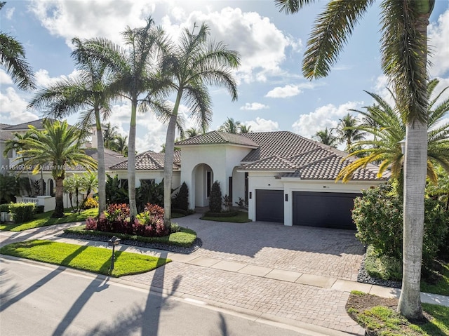 mediterranean / spanish-style house featuring a garage