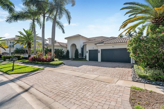 mediterranean / spanish house with a garage