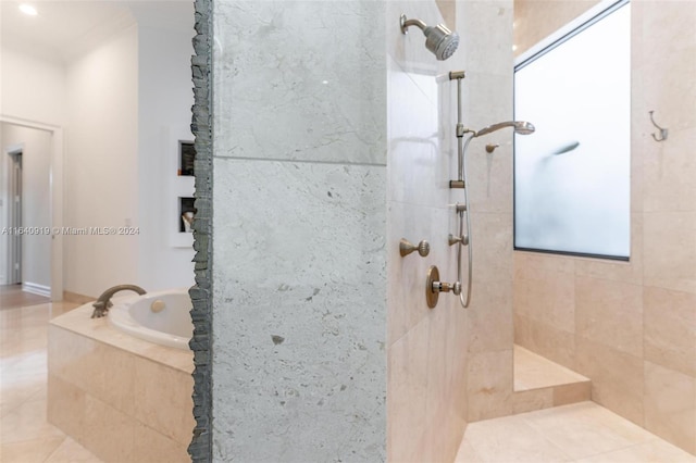 bathroom featuring shower with separate bathtub and tile patterned flooring