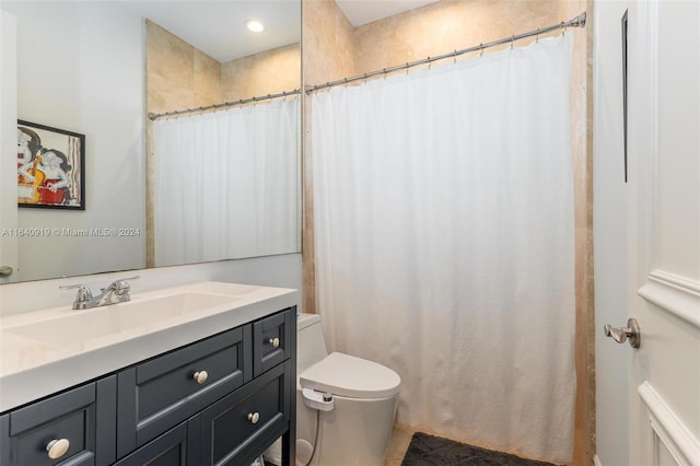 bathroom with vanity, tile patterned flooring, and toilet