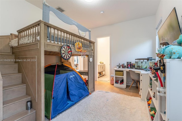 bedroom featuring light wood-type flooring