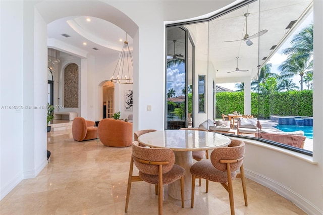 dining space featuring ceiling fan, light tile patterned floors, and a wealth of natural light