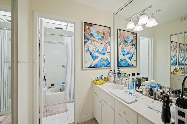 bathroom with vanity, shower / bath combo, and tile patterned flooring