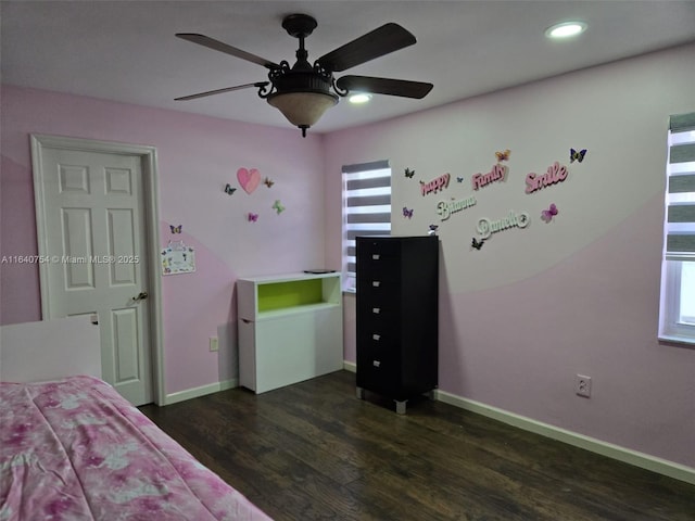 unfurnished bedroom with ceiling fan and dark hardwood / wood-style flooring