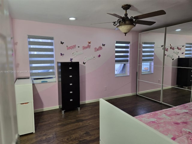 bedroom with ceiling fan and dark hardwood / wood-style flooring